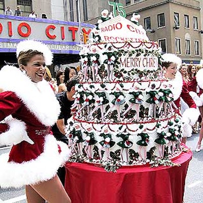 Match Catering & Eventstyles designed a huge, three-tiered cake adorned with 75 Rockette Barbie dolls, which was wheeled out onto the street.