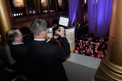 Trumpet players signaled guests to take their seats for dinner.