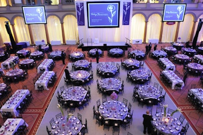The event's signature color—purple—was represented in the floral arrangements, table linens, and signage.