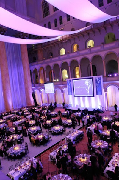 The dining room included purple-lit sashes hanging from the ceiling and a main stage dressed in purple with three large flat-screens showing footage of the foundation's recipients.