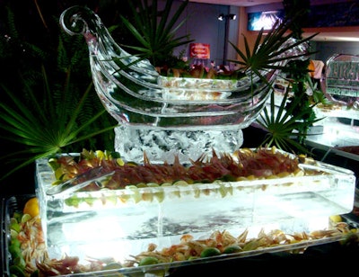 Past the bar, a large seafood buffet of crab claws, shrimp cocktail, and a variety of dipping sauces was arranged on ice sculptures of gondolas created by Sculptured Ice Occasions.