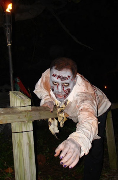 Zombies wandered throughout the haunted graveyard and amongst partygoers.