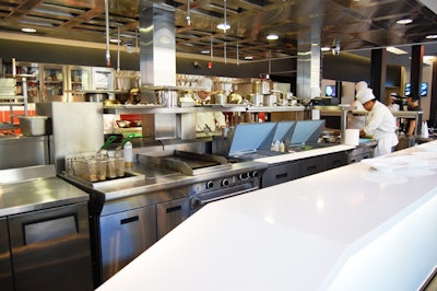 The kitchen, staffed by George Brown Chef School students, is on display in the main space.