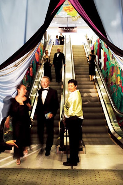 Murals lined the walls of escalators leading into Toronto's Brazilian Carnival Ball, and colorful, parted drapery decorated the base.