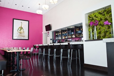 The restaurant's lounge—which features an oversize photograph of a white eggplant—offers seating for 25.