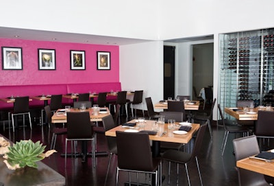 In the main dining room, photographs in simple black frames depict seasonal foods.