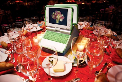 A Centerpiece With a Second LifeFor the Robin Hood Foundation's gala in New York, David Stark created decor with goods that were donated after the event. XO laptops served as centerpieces and flashed images of flowers, statistics, and a dinner menu.