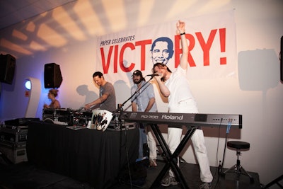 A sign acknowledging Barack Obama's victory the night before sat behind the DJ station at the launch party.