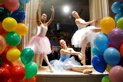 Ballerinas from famous New York-based troupes posed in the store windows.