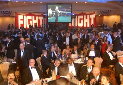 Sparsely decorated tables crowded the ring at Fight Night.