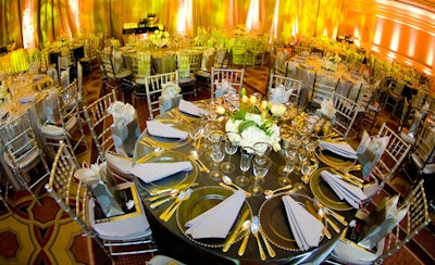 At Knock Out Abuse, pewter tablecloths matched silver Chiavari chairs.