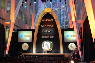 The set—created by designer James Andraza and installed by McWood Studios—featured the names of this year's inductees and included an archway that replicated the venue's ceiling.