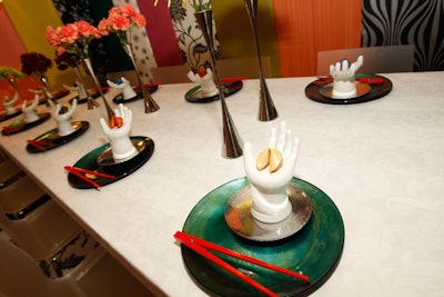 At a table that a design team from McDonald's Corporate created and MDC Wallcoverings sponsored, place settings layered hues of silver and lustrous blue.