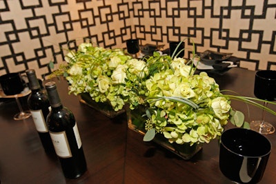 A low, green arrangement crowned the table that J.A.T.C. and Faux Design Studio designed for the Finishing Contractors Association.
