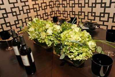 A low, green arrangement crowned the table that J.A.T.C. and Faux Design Studio designed for the Finishing Contractors Association.