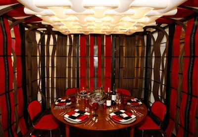 Harrington College of Design students decorated their installation with ribbon-like strips of dark wood and a complementary table.
