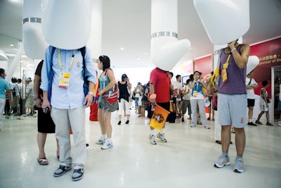 Cell phone stations hanging from the ceiling at the Samsung pavilion allowed guests the chance to sample music, movies, and television series.