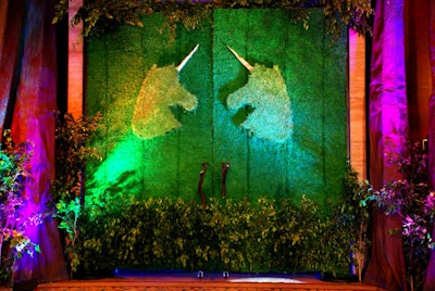 The ballroom doors were adorned with greenery and unicorn images to channel the enchanted-forest ambience.