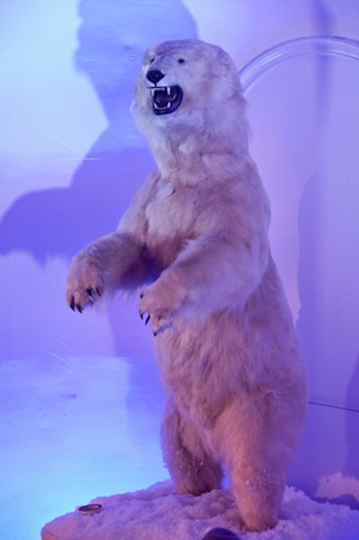An eight-foot-tall stuffed polar bear stood in a niche behind the DJ booth.