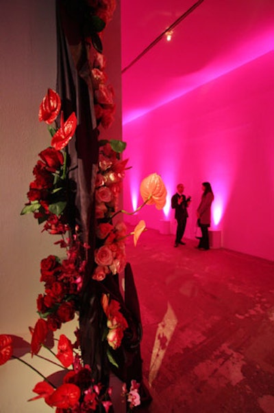 Fabrics and flowers covered the entryways and, in contrast to the dinner section, BAM washed the hallway with rosy pink lighting.