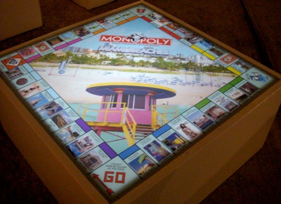 Glow tables from Ronen Bar and Furniture Rental were customized with the new Monopoly game board.