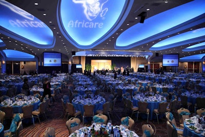 The Washington Hilton ballroom was awash in aqua blue with the Africare logo in white.