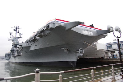 The Intrepid, a former aircraft carrier, sits on the Hudson River, less than 10 blocks north of the Jacob K. Javits Convention Center.