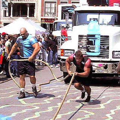 Strongmen Brian Neese (left) and Chad Coy pulled Coca-Cola tractor-trailers weighing several tons, all in an effort to drive home Powerade's new 'Very real power' slogan.