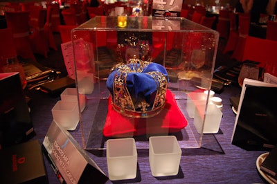 Plexiglas boxes covered red pillows topped with crowns on tables in the London-themed dining area.