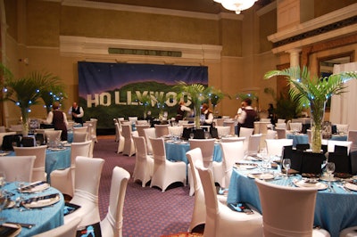 The decor in the Los Angeles-themed dining room included a mural of the famous Hollywood sign and vases filled with palm leaves and blue twinkle lights.