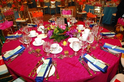 Fuchsia, blue, and purple linens topped tables, and bangles served as napkin holders.