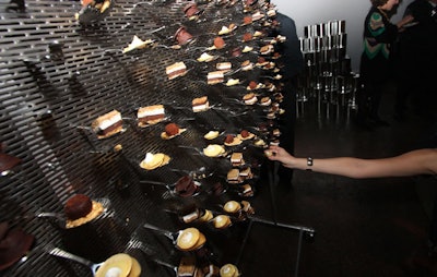 Guests plucked desserts like truffles and s'mores from a wall covered with hundreds of spoon branches designed by Performa general manager Esa Nickle.