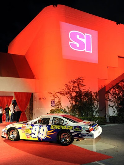 The outside of the venue was washed in red lighting and official Nascar vehicles were placed on the red carpet.