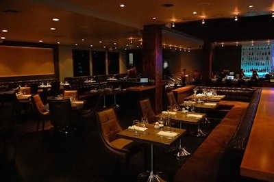 Code features a dining room done in dark shades.