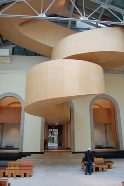 A sculptural staircase links Walker Court to the A.G.O.'s new third-floor event space.