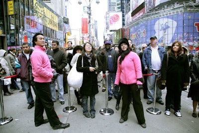 Passersby—mostly tourists and tardy commuters—lined up as soon as the M.C. started shouting promises of free clothing just before 10 a.m.