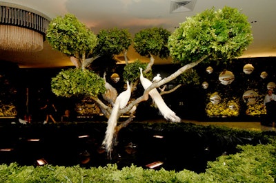 Two 24-foot bonsai trees with white birds were set up in the walled-in garden created in the Luster gallery.