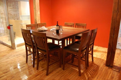 The chef's table seats eight in an open-concept kitchen.
