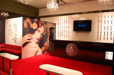 The Akvinta Vodka display in the Spiritology Pavilion featured sleek red seating, a black bar, and ornate chandeliers.