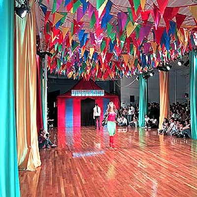 Bestek Lighting & Staging, Philip Baloun and the Diesel creative team worked together to create the Dieseland set, which included a small circus tent and colorful satin wrapped around the Puck Building's white floor-to-ceiling pillars.