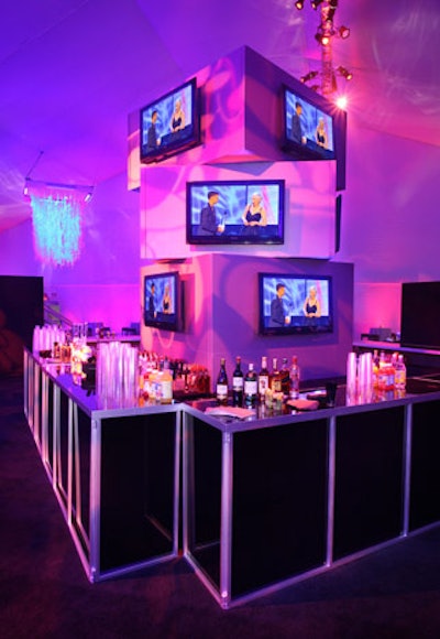 Panasonic supplied flat screens above angular black bars at the official after-party; the electronics brand donated 25 50-inch plasmas and one 103-inch plasma for the after-party. 'The eye-candy throughout the party was these screens and the replay of the show,' said 15/40's Travis Jackson.