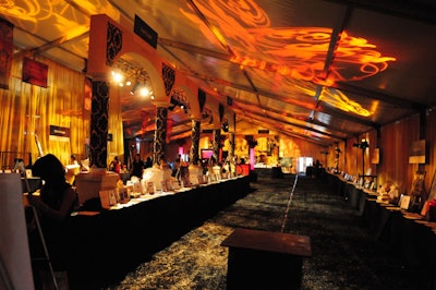 The silent-auction area was decorated with faux column archways and gobo lighting.