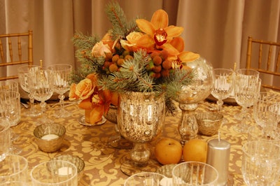 Gold and silver centrepices topped tables at Holt's Cafe for a dinner created by chef Corbin Tomaszeski.