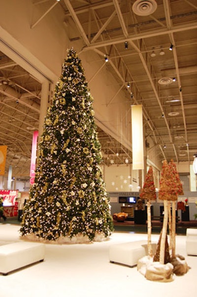 A Christmas tree stands in the centre of the show floor.