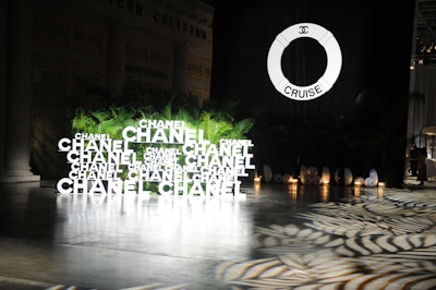 An oversize life preserver and black and white beach balls provided a backdrop for the step-and-repeat at the entrance to the event.