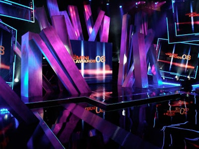 Show producers lit the black and silver set, which featured a series of tall squared-off pillars, in a range of colours during the broadcast.