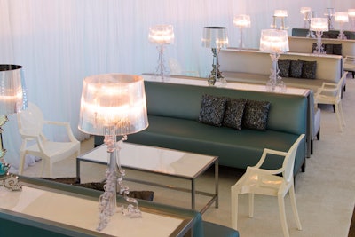 Silver and white furniture from Contemporary Furniture Rentals filled an area called the ice lounge.