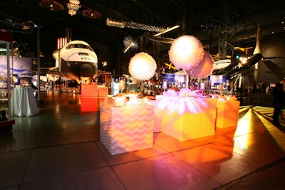 Dessert stations circled the space shuttle Enterprise, and illuminated boxes drew the guests to the rear of the hangar.