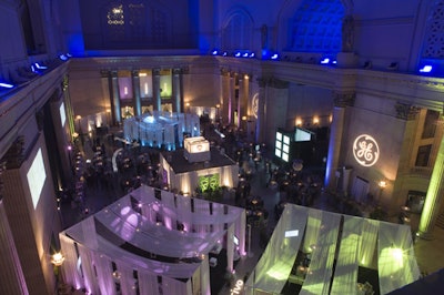 Three lounge areas—highlighted in purple, green, or blue lights—each showcased a new GE brand.