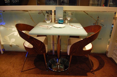 Custom chairs and tables fill the space, designed by the Hirschberg Design Group.